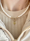 Pearl necklace with 9 carat gold designer bolt clasp and initial