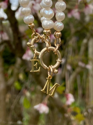 Pearl necklace with 9 carat gold designer bolt clasp and initial