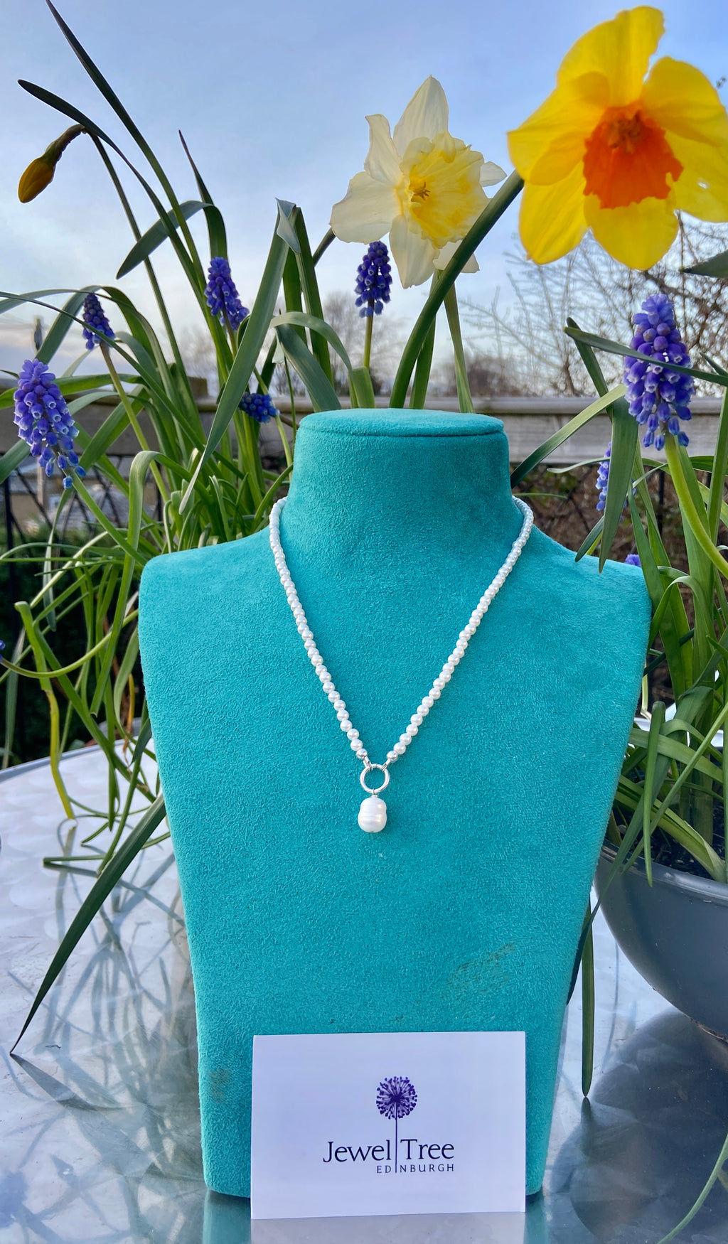 Pearls with freshwater pearl dangle