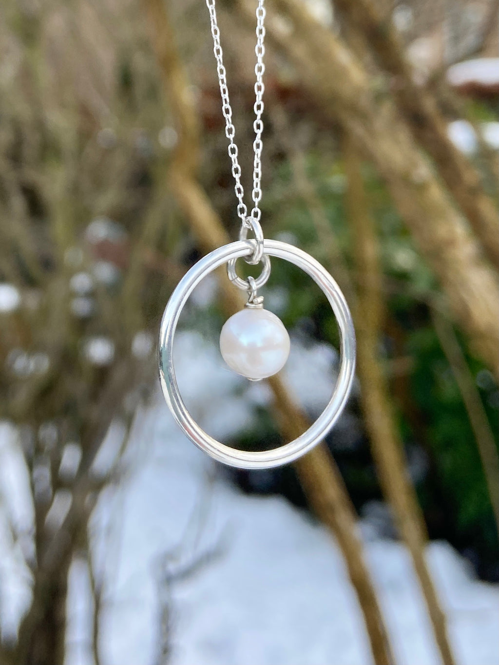 Freshwater pearl and circle of life pendant