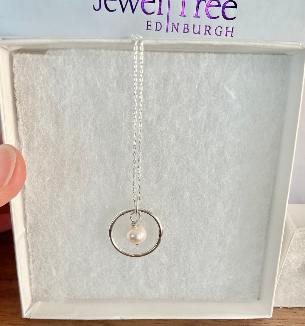 Freshwater pearl and circle of life pendant