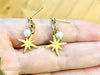 Gold North Star earrings