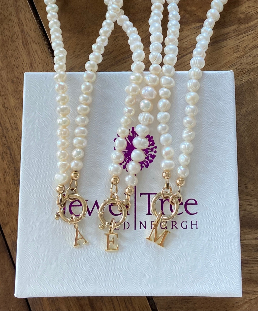 Pearl necklace with 9 carat gold designer bolt clasp and initial